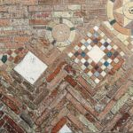 Closeup_of_the_ancient_brick_wall_of_the_Basilica_of_Santo_Stefano_also_called_the_Seven_Churches_in_early_Christian,_Romanesque_and_Gothic_style._Bologna,_Emilia-Romagna,_Italy,_Europe.