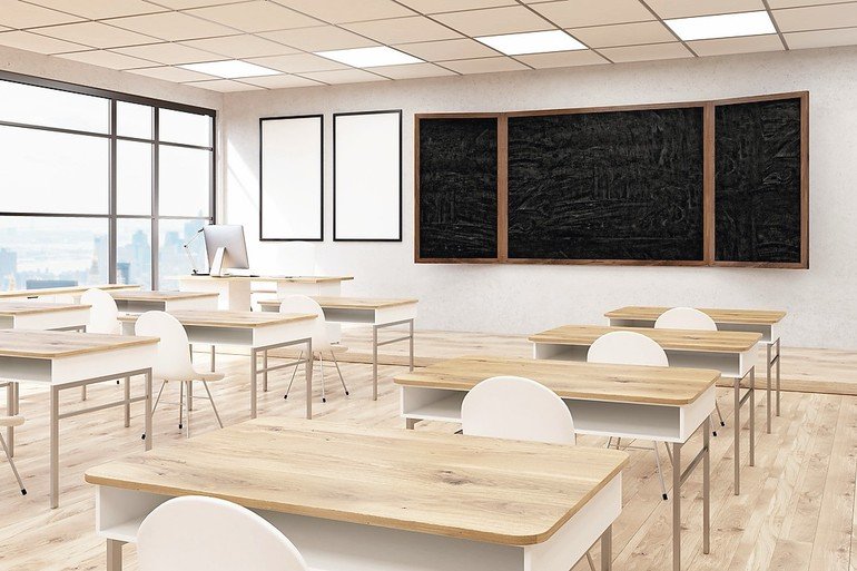 Business_University_classroom_interior._Blackboard_and_posters_on_wall,_wooden_desks_and_plastic_chairs._Concept_of_obtaining_knowledge._Back_to_school._3d_rendering._Mock_up